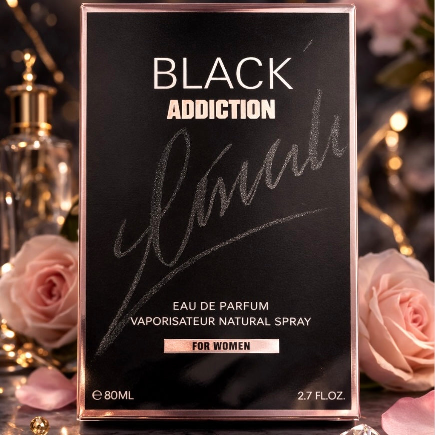 Black Addiction perfume packaging with roses in the background