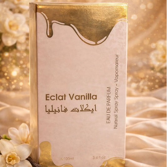 Eclat Vanilla perfume packaging with gold accents on a soft, blurred floral background