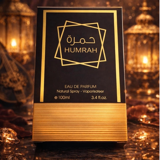 Humrah inspired eau de parfum packaging with gold accents on a dark background