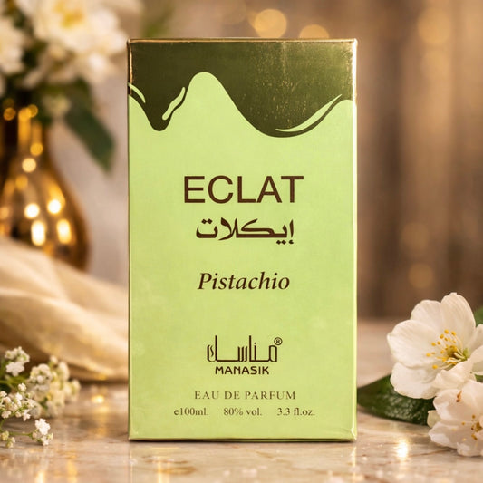 Green ECLAT Pistachio perfume box with flowers in the background