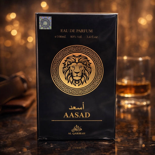 Eau de Parfum packaging with a lion emblem and 'AASAD' branding on a dark background.