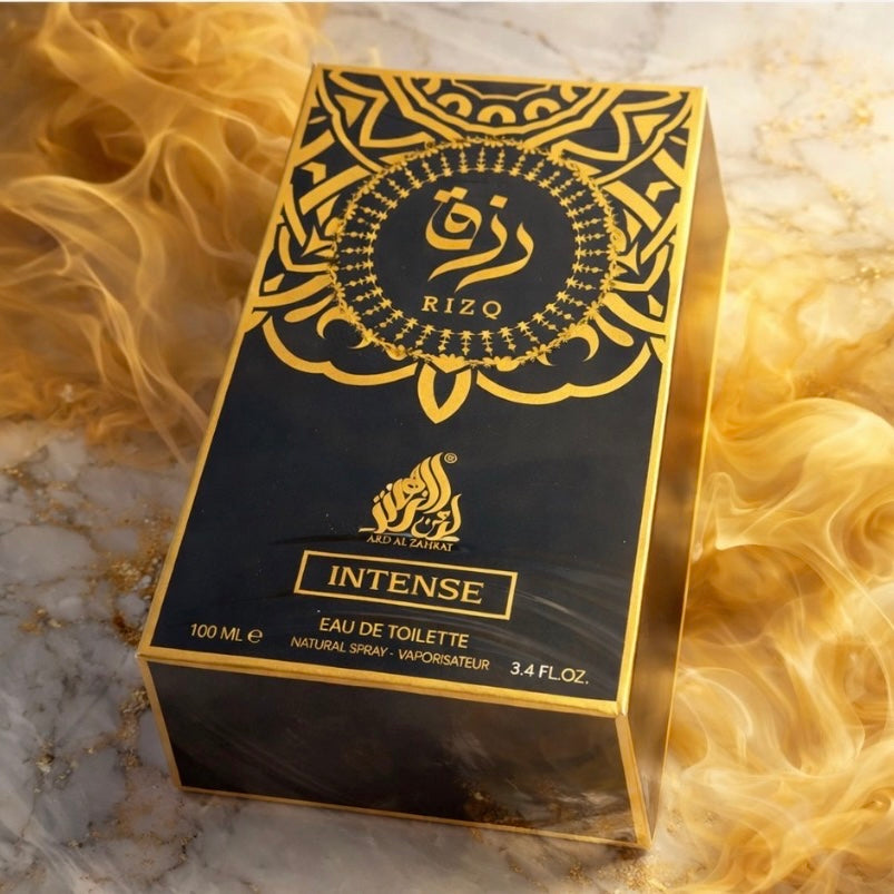 Rizo Intense perfume box on a marble surface with flames