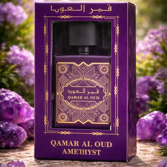 Qamar Al Oud Amethyst perfume bottle in a purple box with floral background